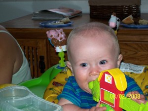 Aiden in an exersaucer.