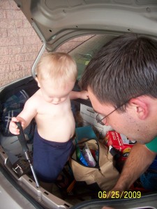 "Helping" dad and grandpa replace a brake light.