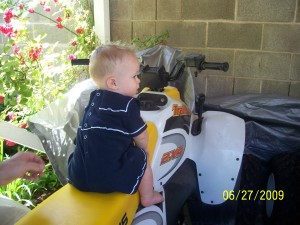 Sitting on a 4-Wheeler.