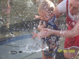 Playing in the fountain.