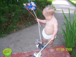 Playing with grandma's pinwheels.