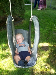 Swinging in the tire swing at Denson's