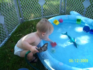 Swimming in my pool and playing with the sprinklers.