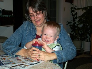 Aiden trying to pull the lid off of his sippy.