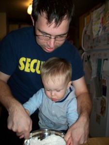 Stirring with daddy.