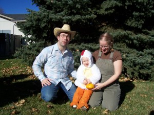 Mr. and Mrs. Farmer and their baby chicken.