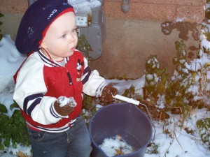 Aiden was filling this bucket with snow.