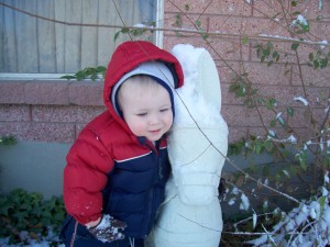 Hugging grandpa's donkey.