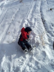 Aiden tries sliding on his rear end.  It wasn't too effective.