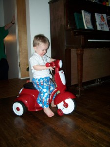 Trying out his new tricycle from grandpa.