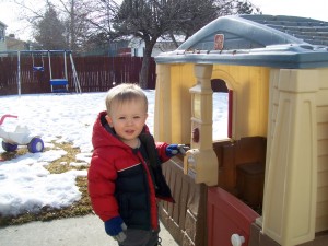 Pushing the doorbell.