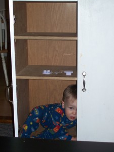 Hiding in his little cupboard.