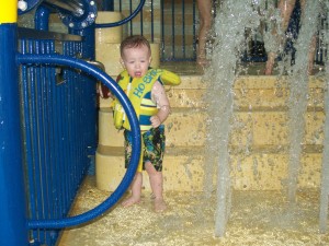 Playing with the levers at the pool.