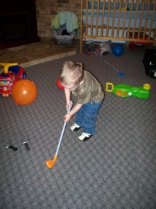 Aiden playing a little golf.