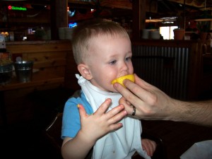 Aiden tasting a lemon.