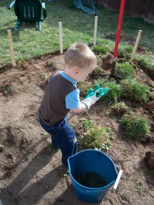 Picking up grass clods.