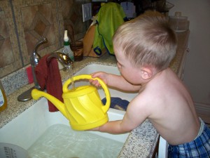 He loves this watering can.