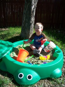 Aiden playing in his new sandbox.